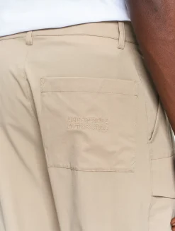 Le pantalon mixte ample Aigle Experience by Études - Beige