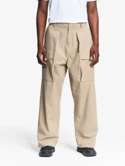 Le pantalon mixte ample Aigle Experience by Études - Beige