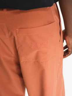 Le pantalon mixte ample Aigle Experience by Études - Orange