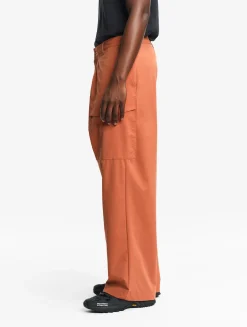 Le pantalon mixte ample Aigle Experience by Études - Orange